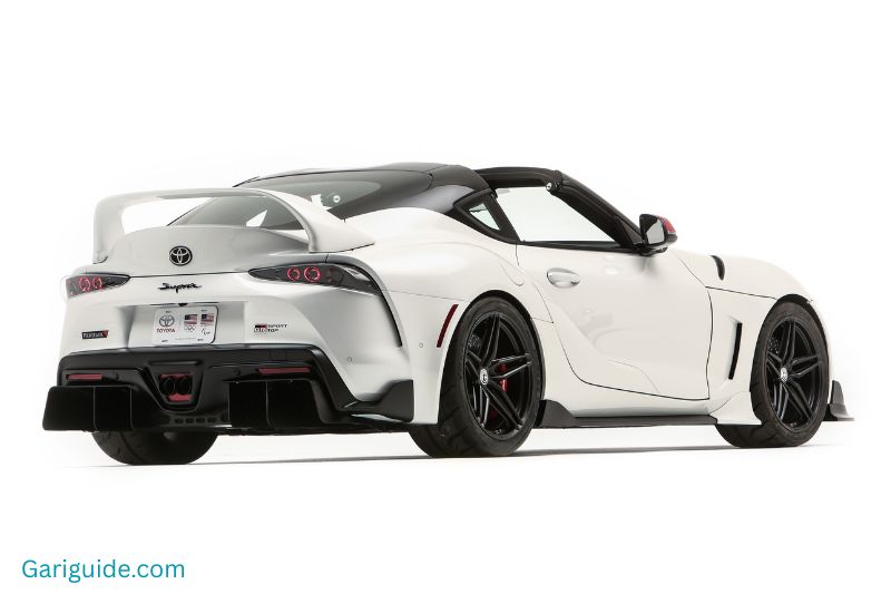 A white Toyota Supra is displayed prominently, highlighting its sleek design and sporty features.