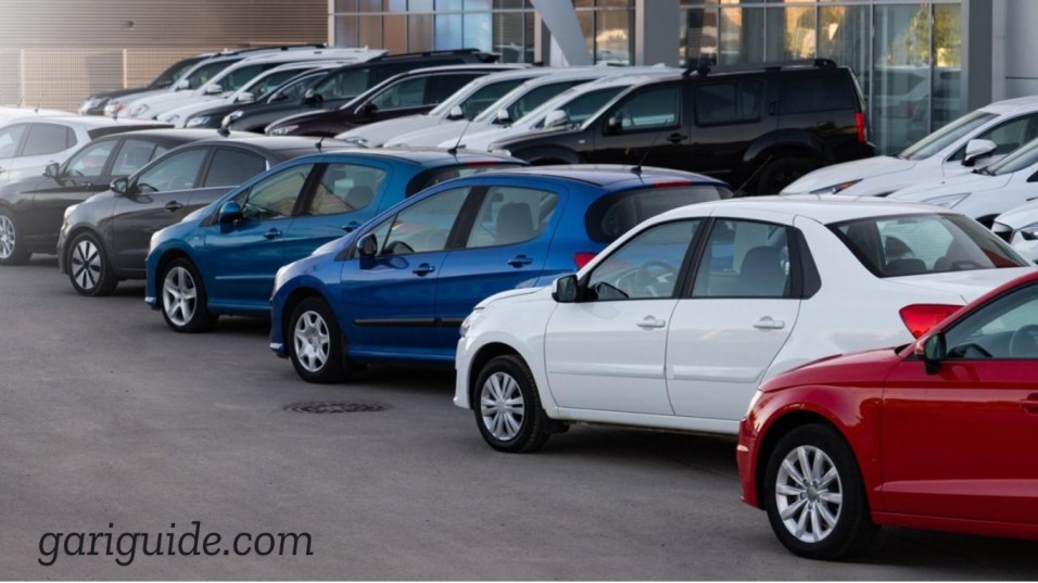 A row of parked cars in a lot, showcasing cheap used cars in Lahore.
