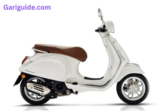A white scooter featuring a red seat, highlighting its sleek look, and Vespa price in Pakistan.